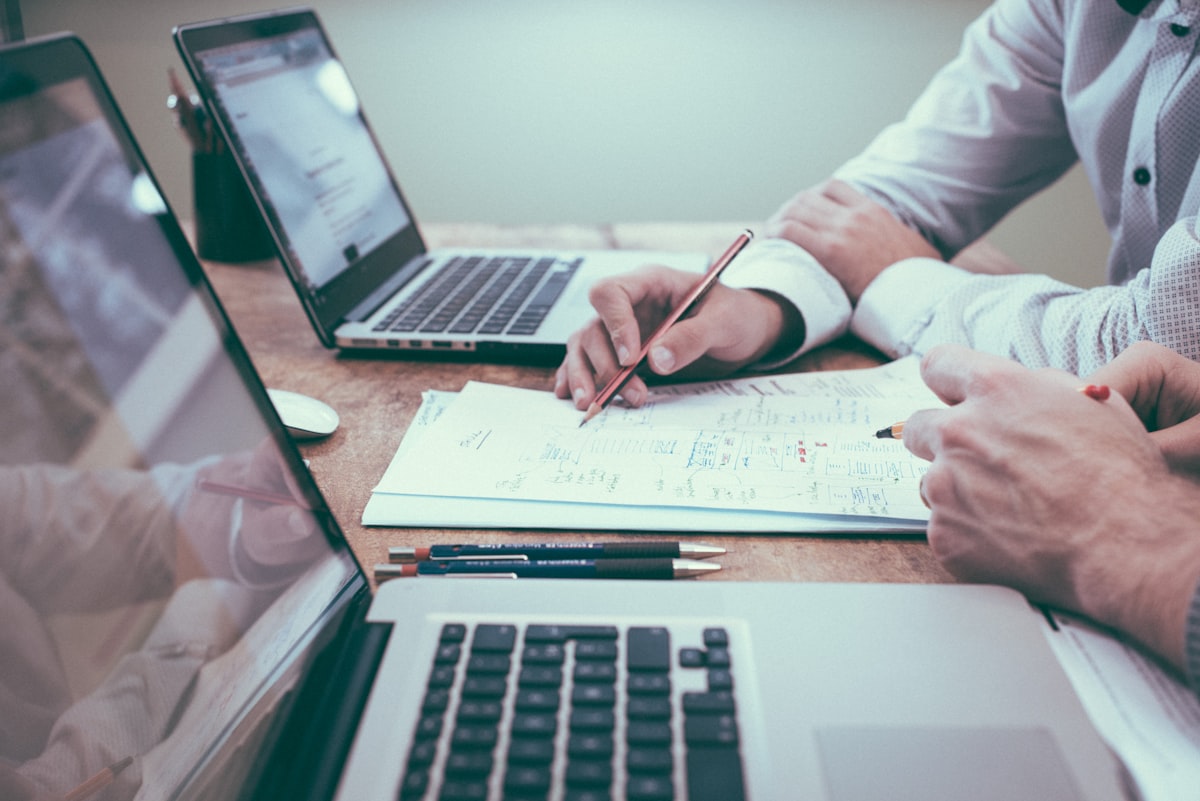 Advisor notes and laptop on a desk during a financial review